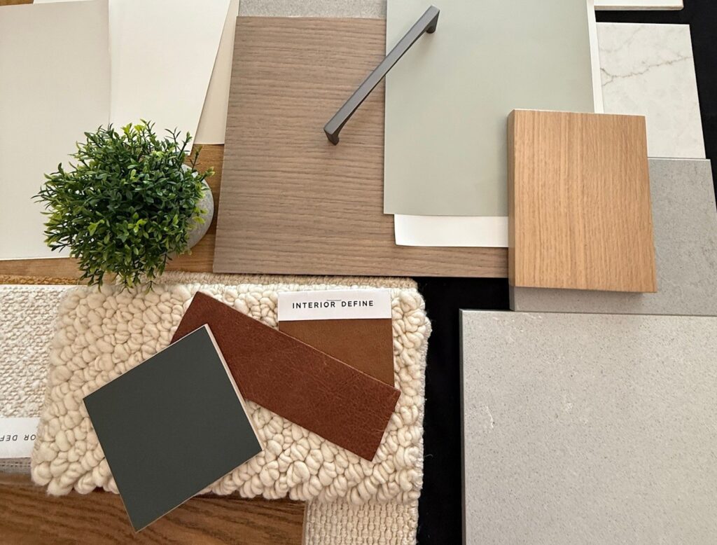 Interior design material palette with wood veneers, stone, tile and textile samples